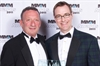 Scott Wolf from Everyday Health presents a Gold Award to Reaves West of Merck