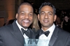 Emcee Ralph Harris congratulates Raj Amin of HealthiNation