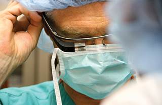 Christopher Kaeding adjusts Google Glass before operating Christopher Kaeding adjusts Google Glass before operating